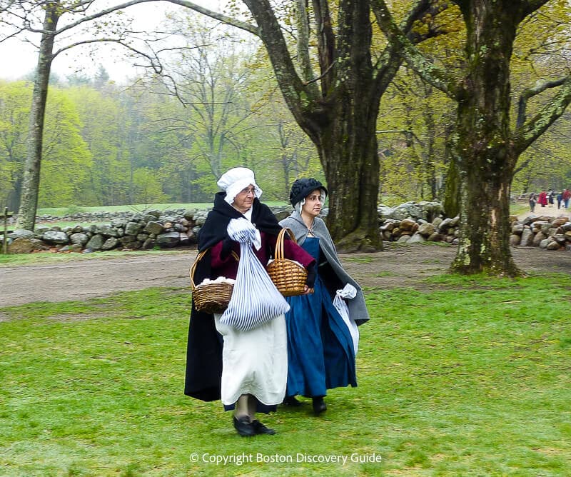 Reenactors portraying 18th century Colonial women near Smith House Reenactors portraying 18th century Colonial women near Smith House