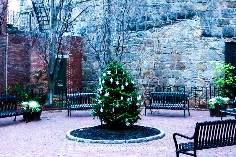 Temple Street Park in December - The gray granite wall is the back of St. John the Evangelist Church Temple Street Park in December - The gray granite wall is the back of St. John the Evangelist Church